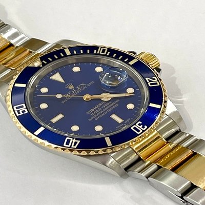 Submariner Date,in steel and gold, with Rolex service papers